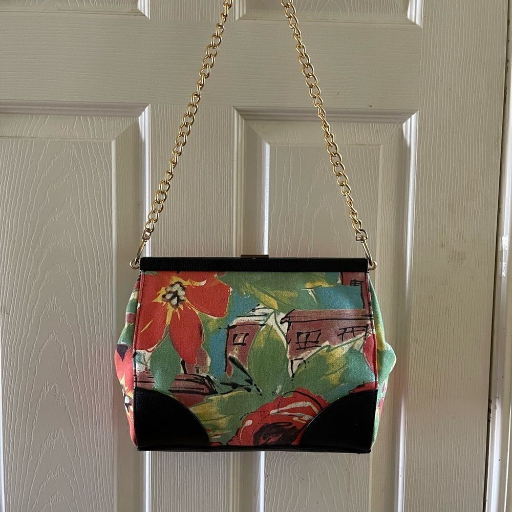 Paradox vintage canvas multi color floral handbag with black trim .